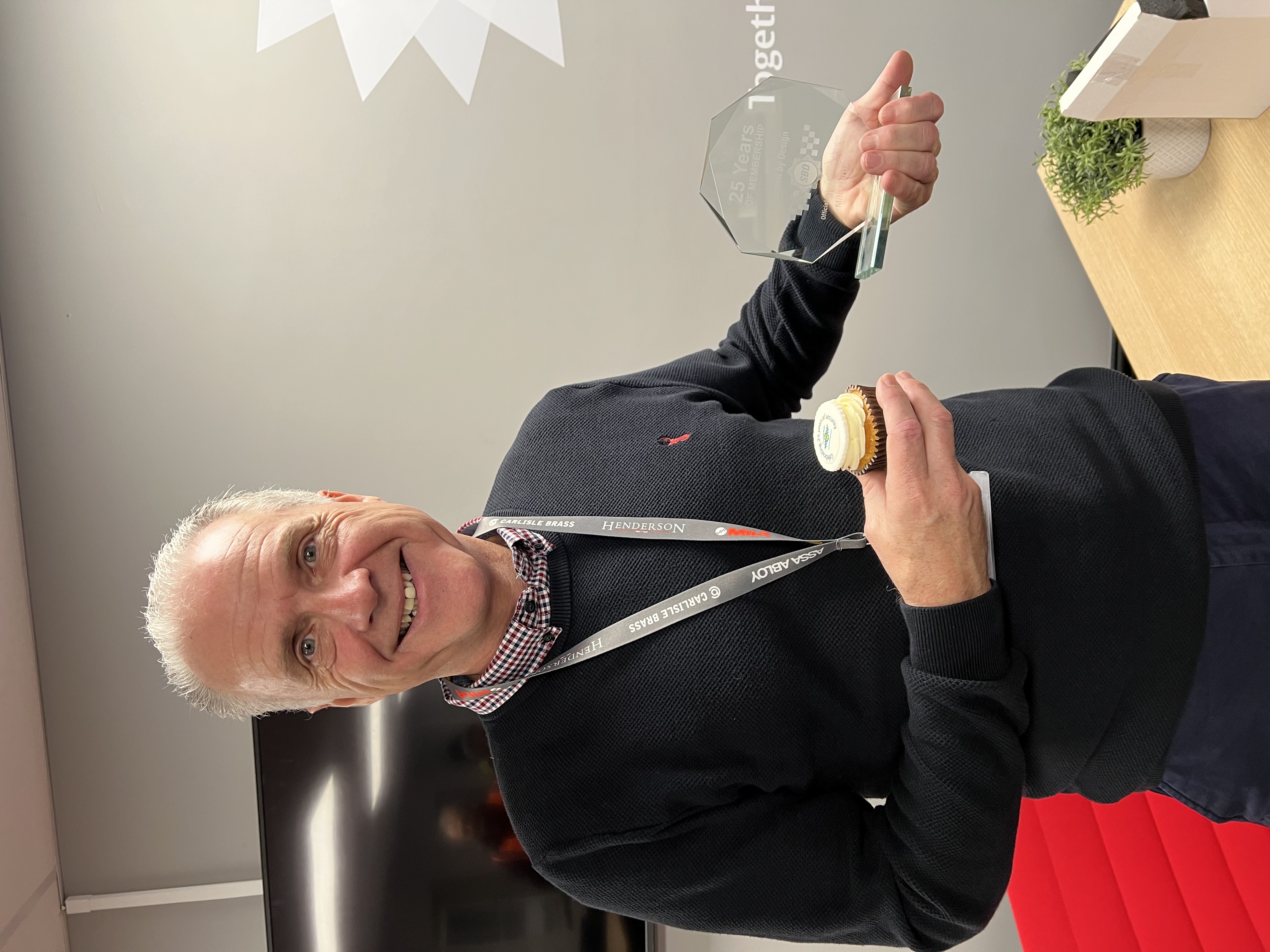Mila and SBD Celebrate 25-Year Partnership with Award and Cake!